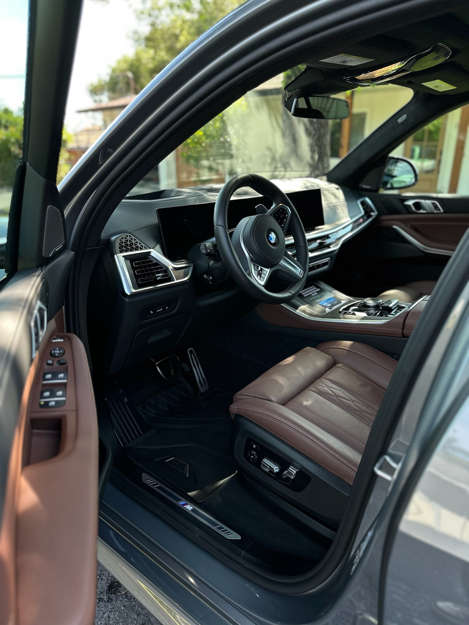 detailed luxury SUV interior and open door after a full-service mobile detail