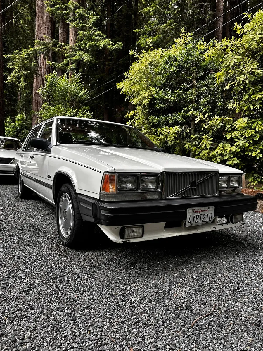 white classic Volvo sedan after an exterior detail
