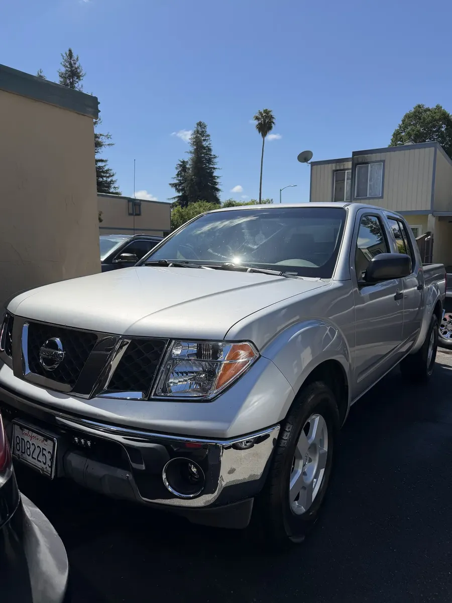 silver Nissan Frontier truck after an exterior detail