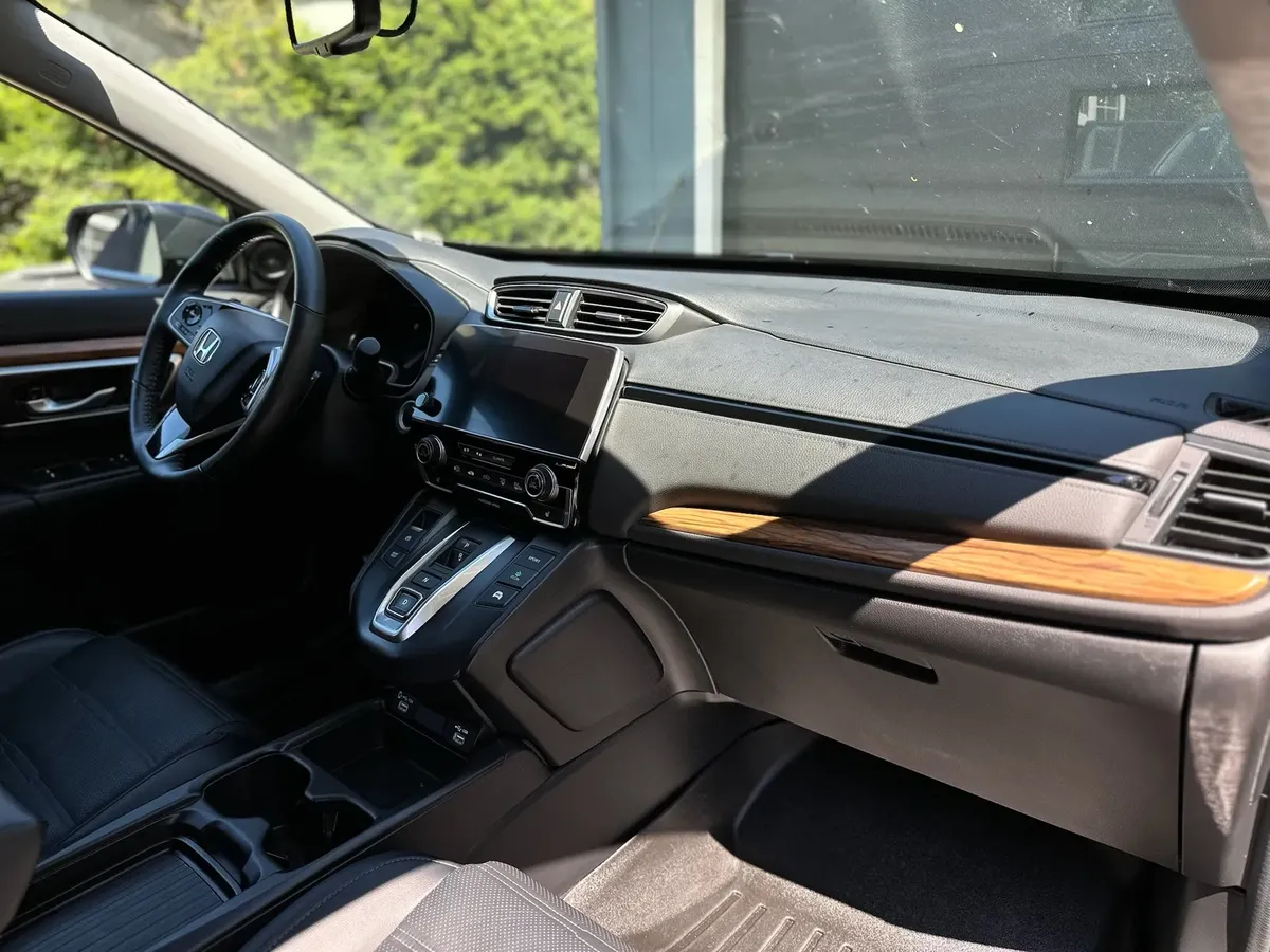 dashboard with wood trim cleaned during interior detailing